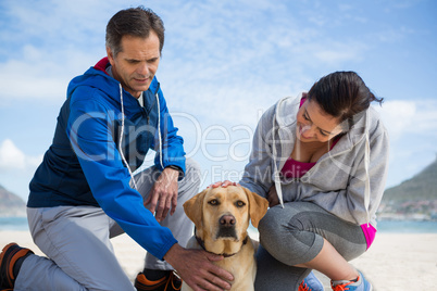 Smiling couple with their pet dog