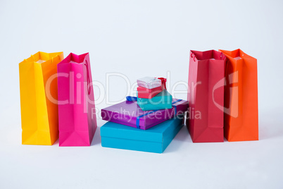 Stack of gift boxes with shopping bags