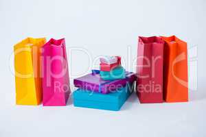 Stack of gift boxes with shopping bags