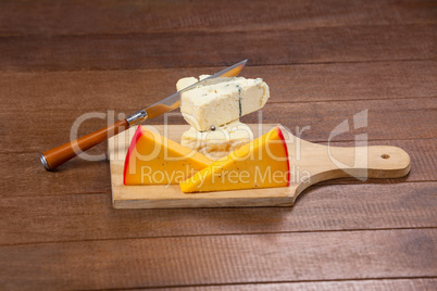 Slices of cheese with knife