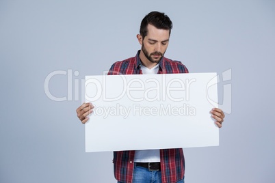 Man holding a blank placard