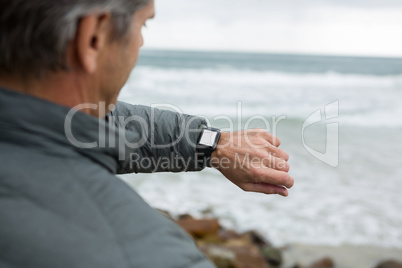 Man checking the time on smartwatch