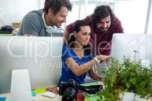 Team of graphic designers working at desk