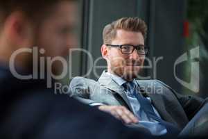 Handsome businessman sitting in office