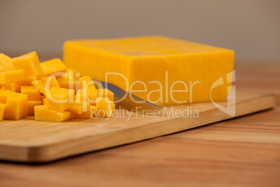 Cubes of cheese with knife