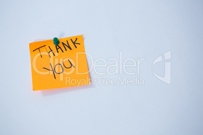 Text thank you written on adhesive note