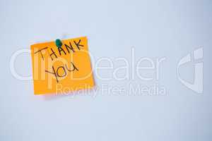 Text thank you written on adhesive note