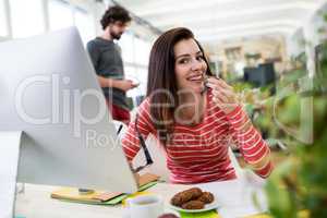 Female graphic designer sitting at desk