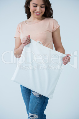 Beautiful woman holding shopping bag