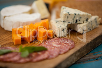 Cheese and ham on chopping board