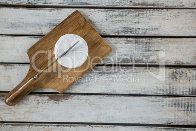 Slice of cheese with knife