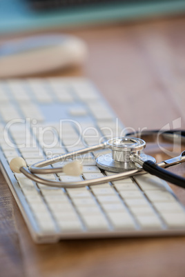 Stethoscope on keyboard in clinic