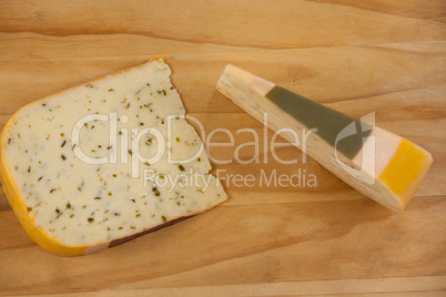 Slice of dutch gouda cheese on chopping board