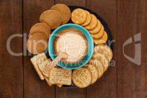 Cheese sauce with crispy biscuits in plate