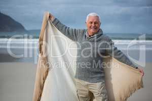 Senior man enjoying on beach