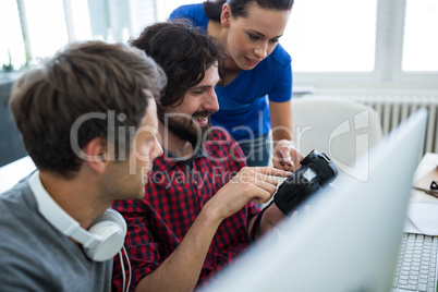 Team of graphic designers looking in camera