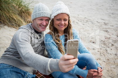 Happy couple taking a selfie from mobile phone