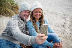 Happy couple taking a selfie from mobile phone