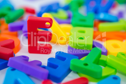 E alphabet standing between toy alphabet