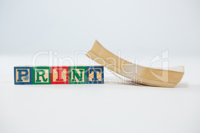 Print letter blocks with book on white background