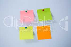 Multicolored adhesive note on white background