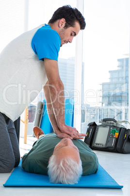 Paramedic performing resuscitation on the patient