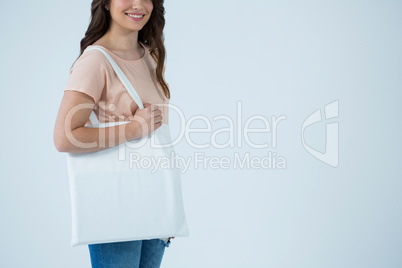 Beautiful woman carrying shopping bag