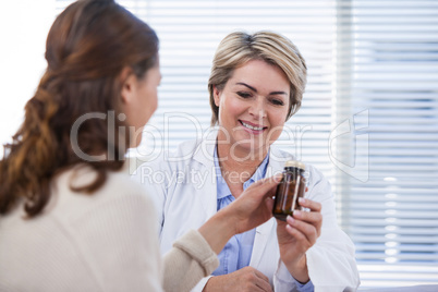 Female doctor explaining medicine to patient