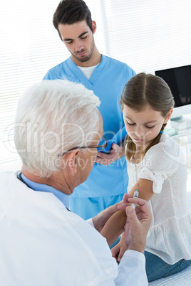 Doctor giving an injection to the patient