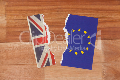 Half torn union jack and european union paper flag