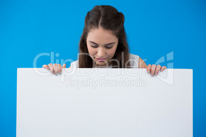 Woman holding a blank placard