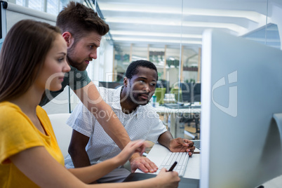 Graphic designers working at desk