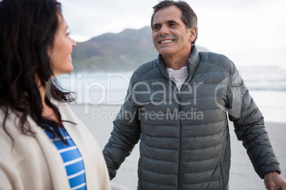 Couple interacting with each other on beach