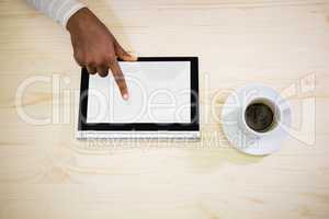 Graphic designer using digital tablet at his desk