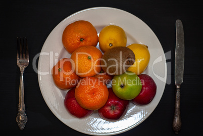 Ripe fruit on a white plate