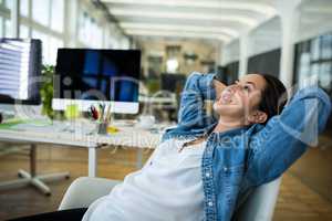 Female business executive relaxing on a chair