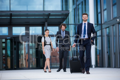 Businesswoman with colleagues walking Businesswoman with colleagues walking