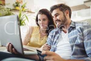 Happy couple shopping online