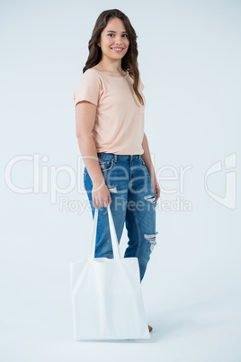 Beautiful woman carrying shopping bag