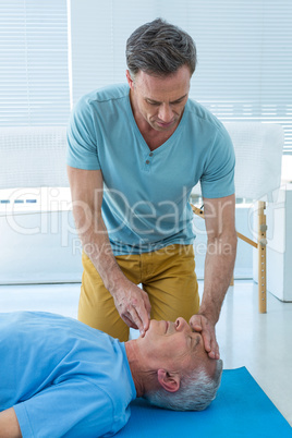 Paramedic performing resuscitation on patient