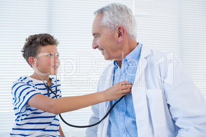 Boy examining the doctor