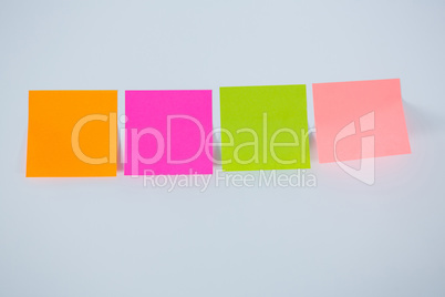 Multicolored adhesive note on white background