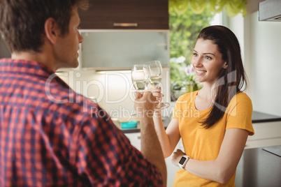 Happy couple toasting glasses of champagne