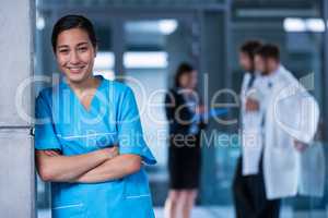 Smiling nurse standing in hospital