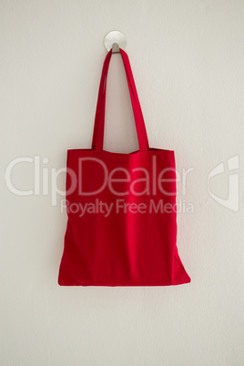 Red bag hanging on wall