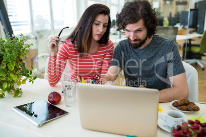 Graphic designers working at desk