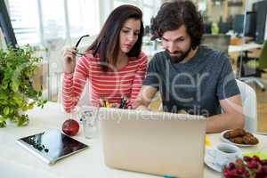 Graphic designers working at desk