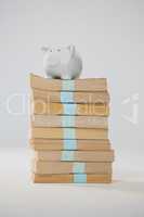 Piggy bank on stack of books