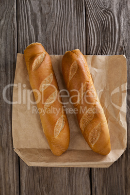 Baguettes on wooden background