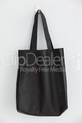 Black bag hanging on wall